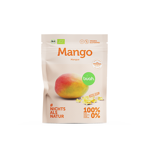 buah gefriergetrocknete Mango im Snackpack mit kleinem Haufen gefriergetrockneter Mango im Vordergrund
