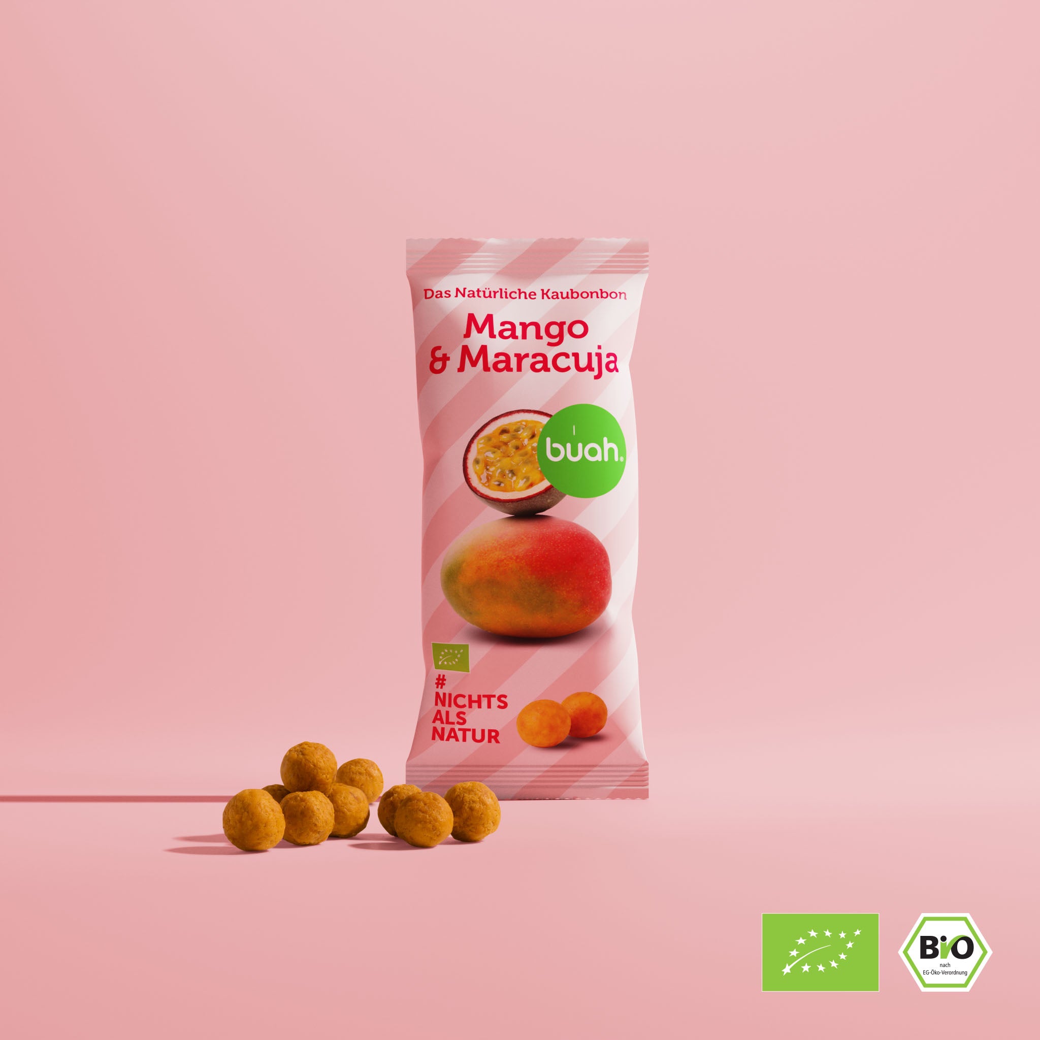 buah Mango-Maracuja Kaubonbon Verpackung vor pink farbigem Hintergrund